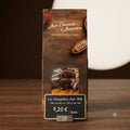 Sachet d'orangettes confites enrobées de chocolat noir 70 % artisanal de la chocolaterie Aux Douceurs d'Alexandre.